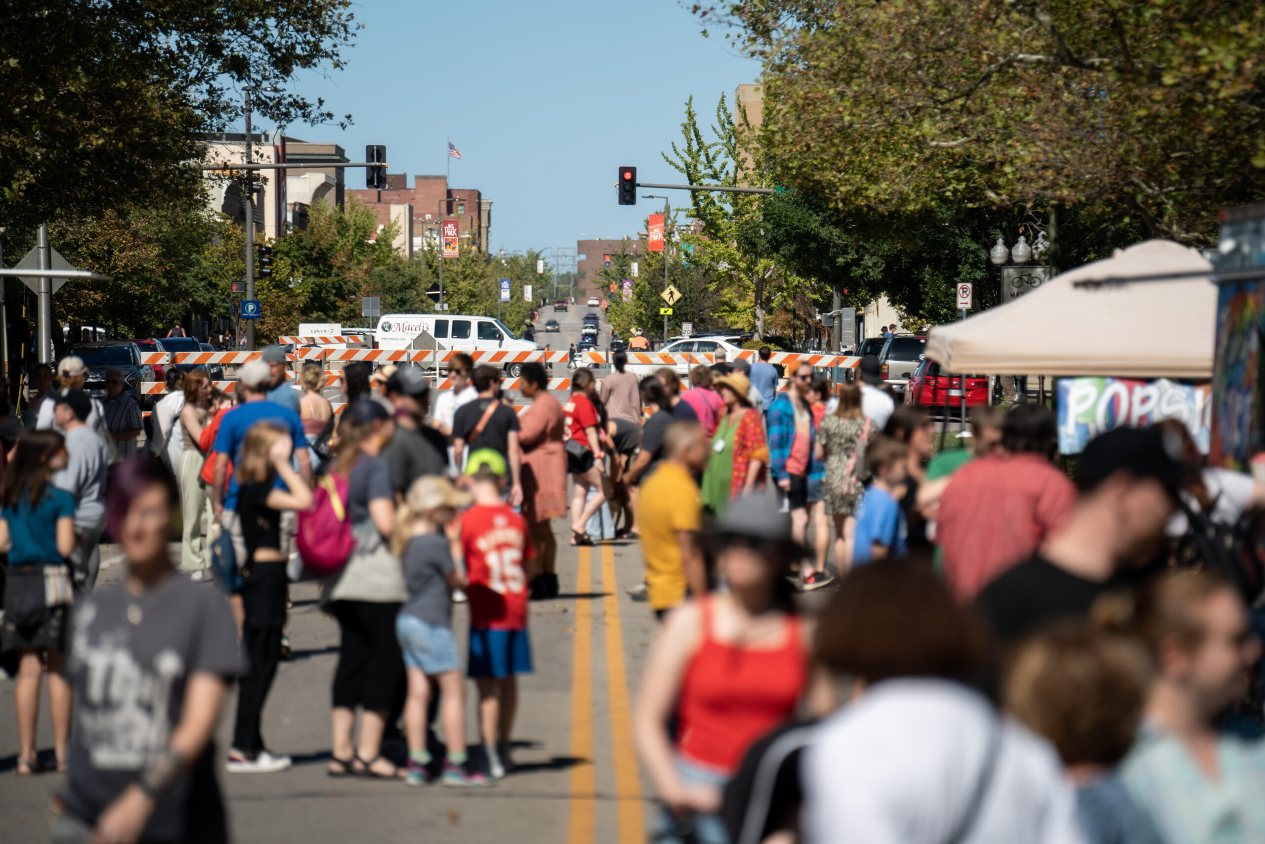 Crowd of people at an event in the right-of-way